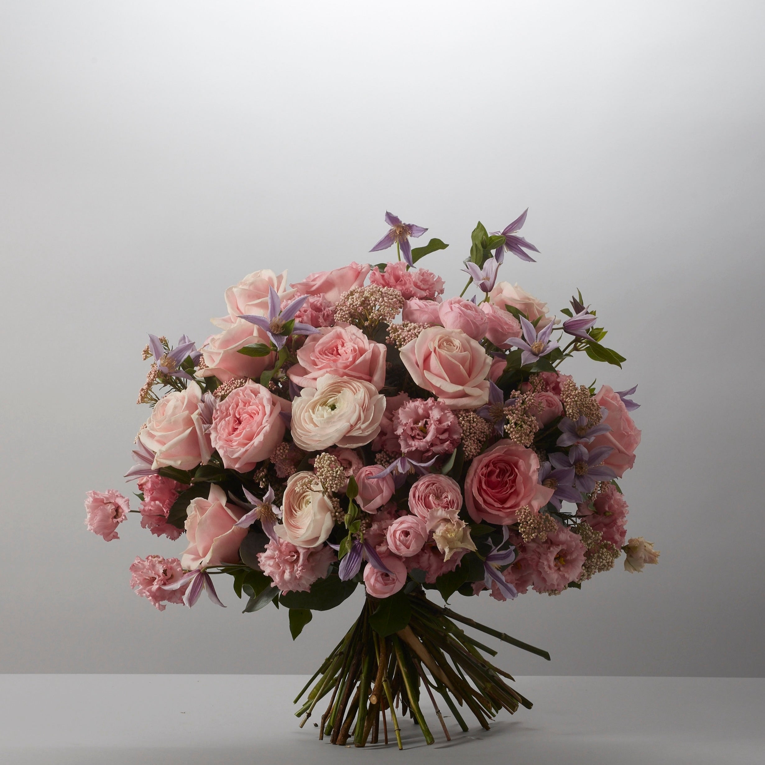 Bouquet of pink and white flowers on a gray background