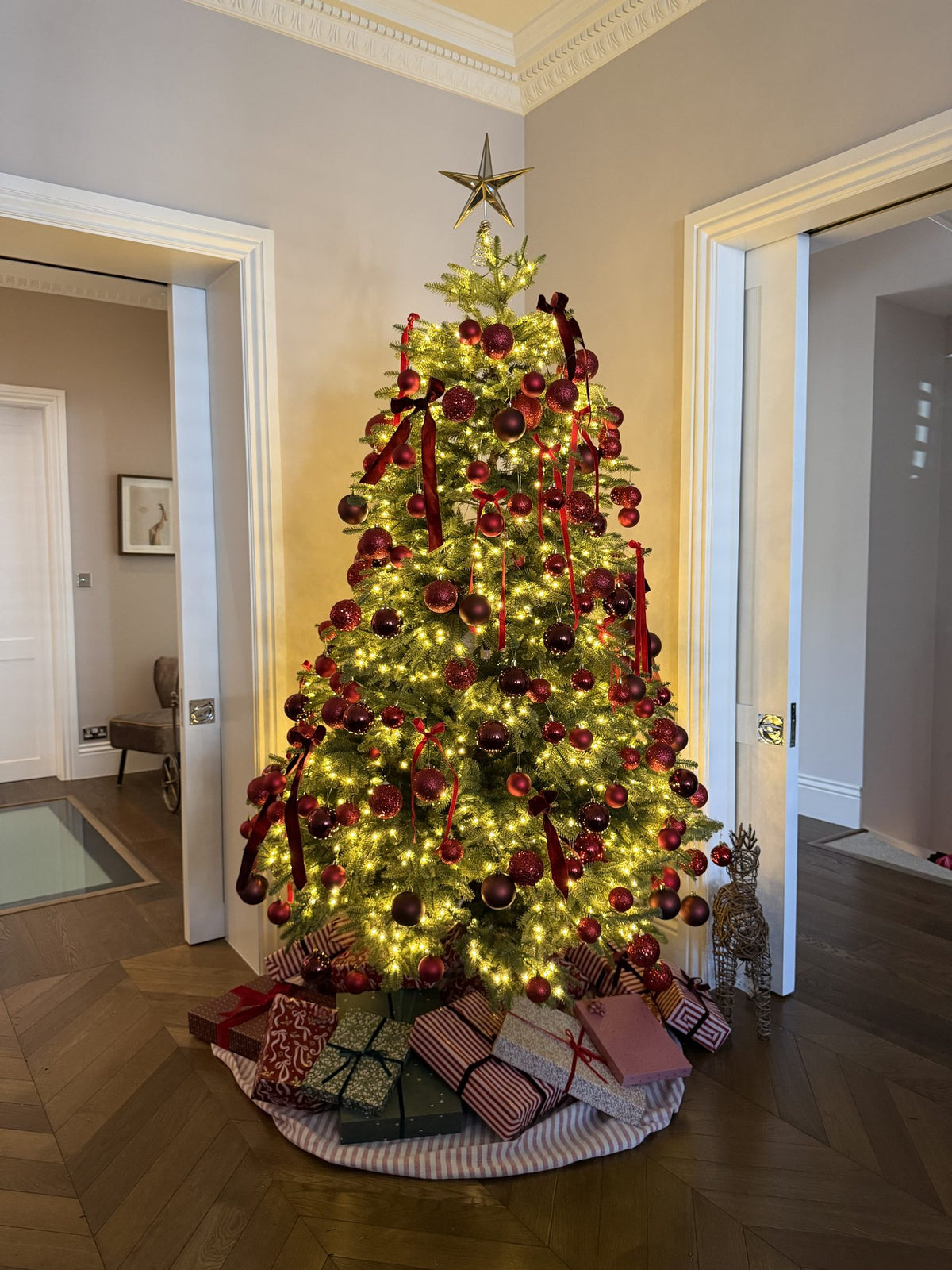 Christmas tree with red baubles and warm lights